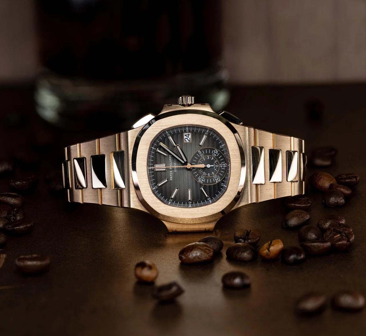 A stainless-steel luxury sports watch with a blue dial.