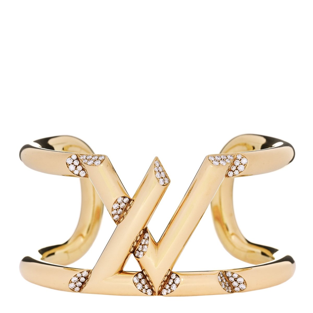 An open yellow-gold cuff bracelet with an angular V motif set with small diamonds.